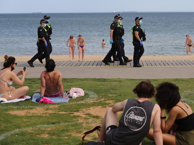 Police patrolling St Kilda beach. Picture: Alex Coppel.