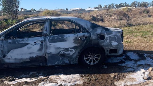 Chinchilla police are investigating a suspected arson after a ‘stolen’ car was found burning in a paddock. Photo/Ella Johnson-Carter.