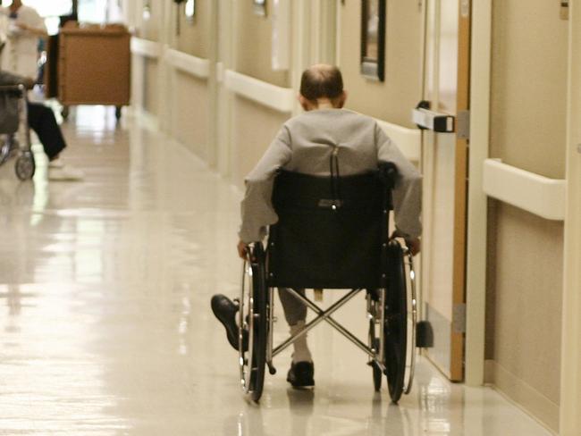 man in wheelchair in aged care nursing home Istock 000001329263large