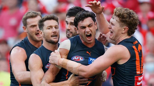 Tom Green (far right) celebrates a Giants goal with Tim Taranto in the round 1 Sydney Derby. Picture: Getty Images