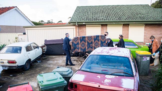 Major Crime detectives remove a sofa from a home in Christie Downs on July 23, 2021, as they investigate the disappearance of Robert Atkins. Picture: Tom Huntley