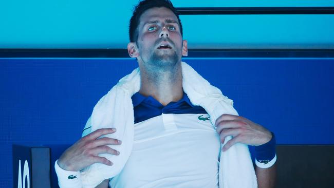 Novak Djokovic tries to cool down during a break.