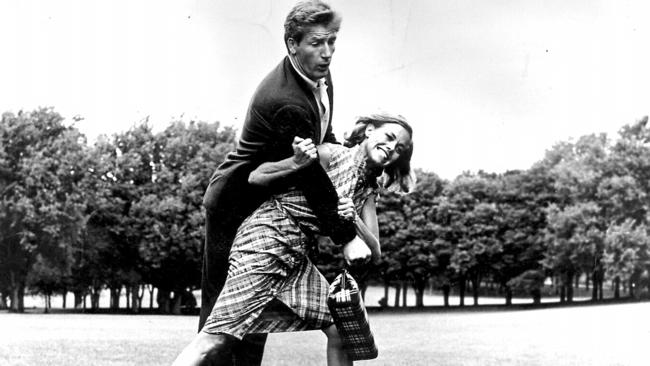 Honor Blackman in a mock tussle with actor and martial arts expert Joe Robinson.