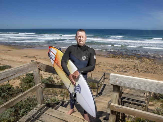 Mike Higgins is the victim of a shark attack. Mike Higgins surveys the surf at Barwon heads bluff. Picture Tim Carrafa