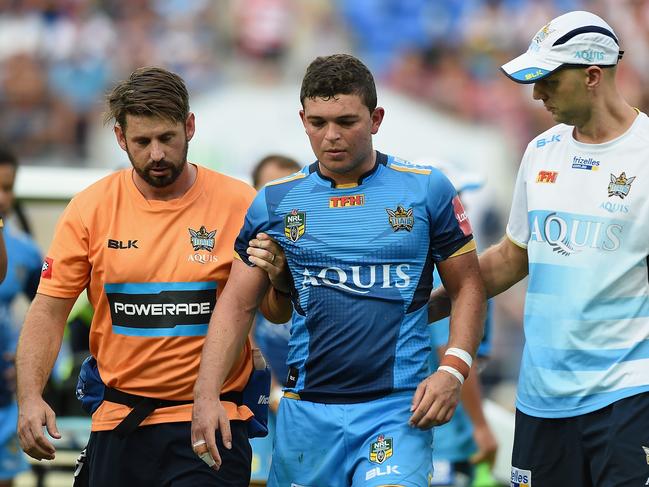 GOLD COAST, AUSTRALIA - APRIL 16: Ash Taylor of the Titans leaves the field injured during the round seven NRL match between the Gold Coast Titans and the St George Illawarra Dragons at Cbus Super Stadium on April 16, 2016 in Gold Coast, Australia. (Photo by Matt Roberts/Getty Images)