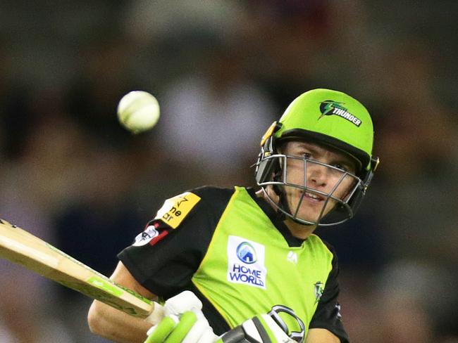 Sam Harper of the Melbourne Renegades looks on as Baxter Holt of the Sydney Thunder plays reverse sweep during the Big Bash League (BBL) match between the Melbourne Renegades and the Sydney Thunder at Marvel Stadium in Melbourne, Wednesday, January 30, 2019. (AAP Image/George Salpigtidis) NO ARCHIVING, EDITORIAL USE ONLY, IMAGES TO BE USED FOR NEWS REPORTING PURPOSES ONLY, NO COMMERCIAL USE WHATSOEVER, NO USE IN BOOKS WITHOUT PRIOR WRITTEN CONSENT FROM AAP