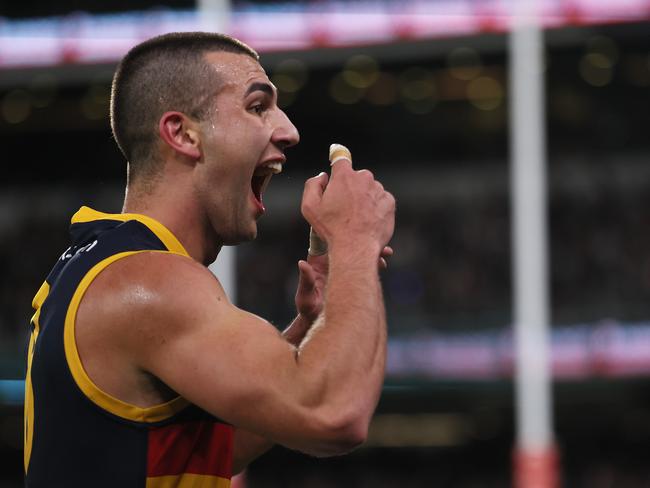 Josh Rachele of the Crows gestures to the crowd after scoring a goal during the Showdown. Picture: James Elsby/AFL Photos via Getty Images)