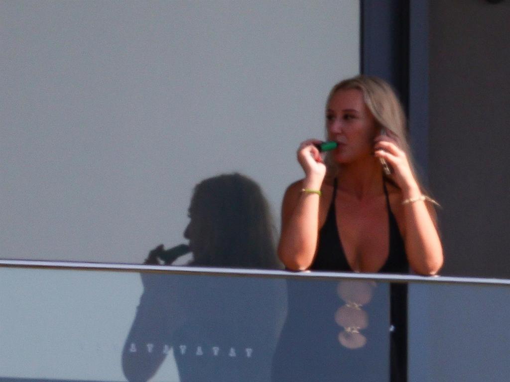 A blonde woman was seen vaping on Bruce Lehrmann’s balcony at his previous address in Balgowlah. Picture: KHAPBM/Backgrid