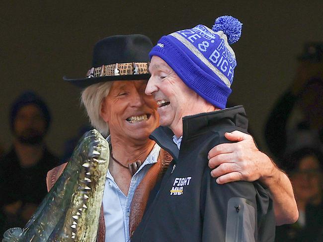 A special moment between Terry and Neale Daniher before Terry went down the slide dressed as Crocodile Dundee. Picture: Michael Klein