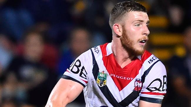 TOWNSVILLE, AUSTRALIA — MARCH 17: Jackson Hastings of the Roosters runs the ball during the round three NRL match between the North Queensland Cowboys and the Sydney Roosters at 1300SMILES Stadium on March 17, 2016 in Townsville, Australia. (Photo by Ian Hitchcock/Getty Images)