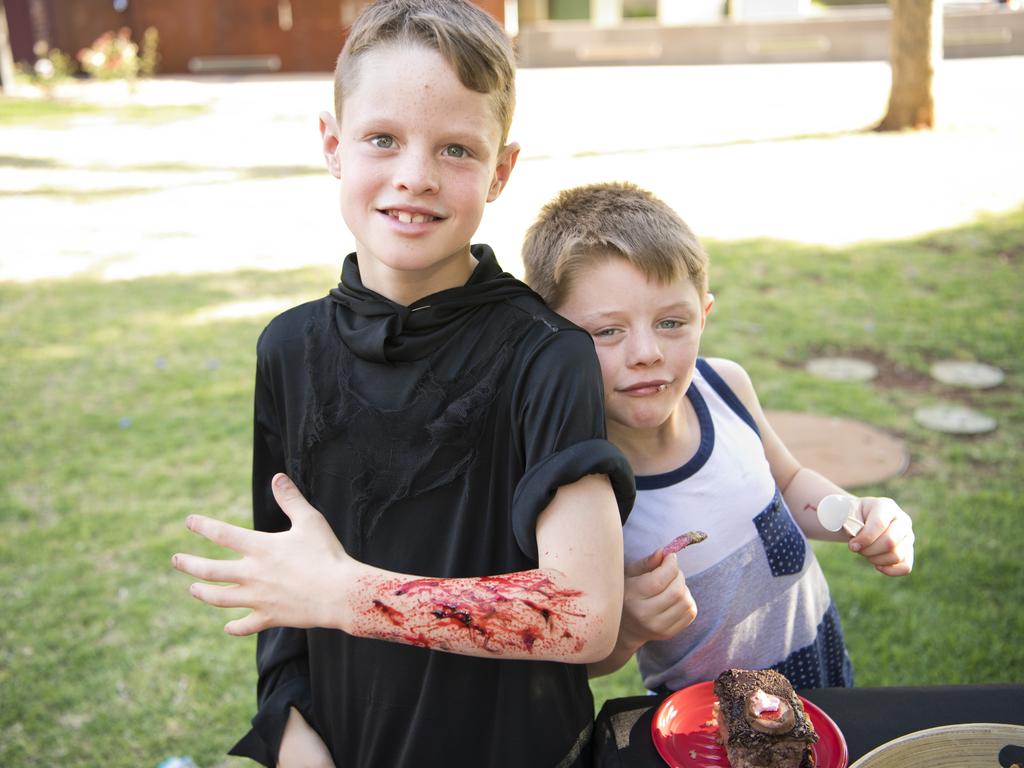 ( From left ) 9 yo Cooper Johnson and 7 yo Hunter Johnson celebrate Hunter's birthday. Halloween family fun event at the Toowoomba Library. Picture: Nev Madsen. Saturday, 26th Oct, 2019.