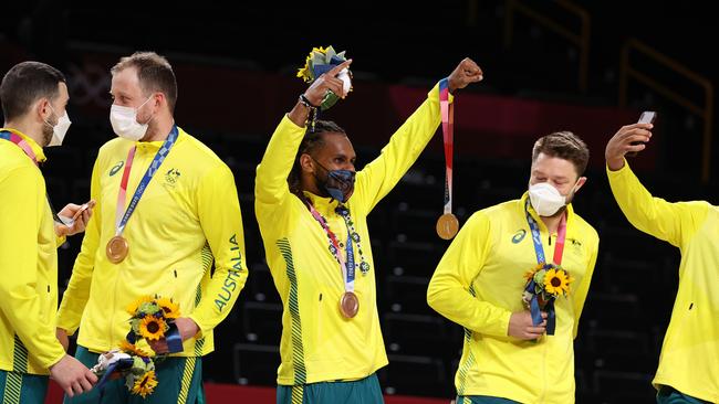 Patty Mills and his Team Australia teammates celebrate with their bronze medals