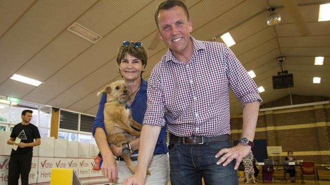 LNP member Scott Emerson with his wife Robyn and dog Taffy vote at Ironside State School, Brisbane, Saturday, November 25, 2017. (AAP Image/Glenn Hunt) NO ARCHIVING, EDITORIAL USE ONLY