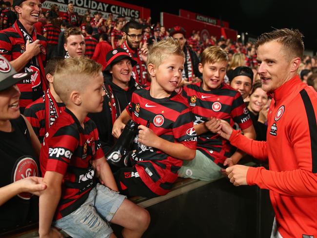 SYDNEY, AUSTRALIA - APRIL 24: Scott Jamieson of the Wanderers signs autographs for fans after winning the A-League Semi Final match between the Western Sydney Wanderers and the Brisbane Roar at Pirtek Stadium on April 24, 2016 in Sydney, Australia. (Photo by Cameron Spencer/Getty Images)