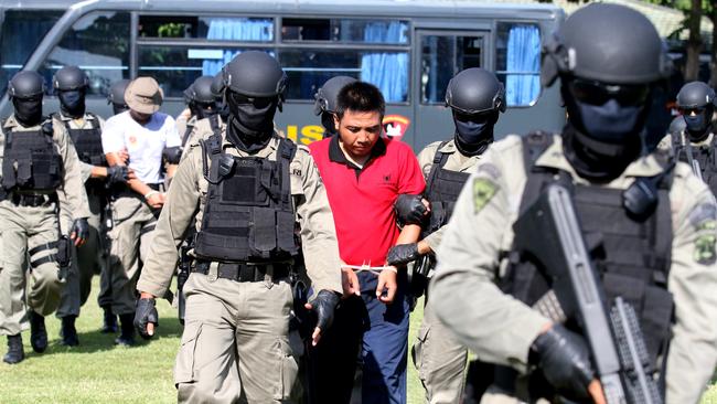 Paramilitary police practise the prisoner transfer in Bali. Picture: Lukman Bintoro