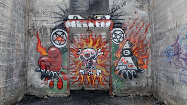 Witches practising black magic are said to have painted these pentagrams and other satanic images inside the tunnels in the 1970s. Picture: Andrew Murray.