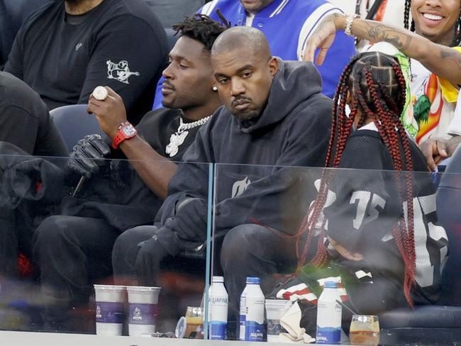 INGLEWOOD, CALIFORNIA - FEBRUARY 13: Antonio Brown, Kanye West and North West attend Super Bowl LVI between the Los Angeles Rams and the Cincinnati Bengals at SoFi Stadium on February 13, 2022 in Inglewood, California. (Photo by Steph Chambers/Getty Images)