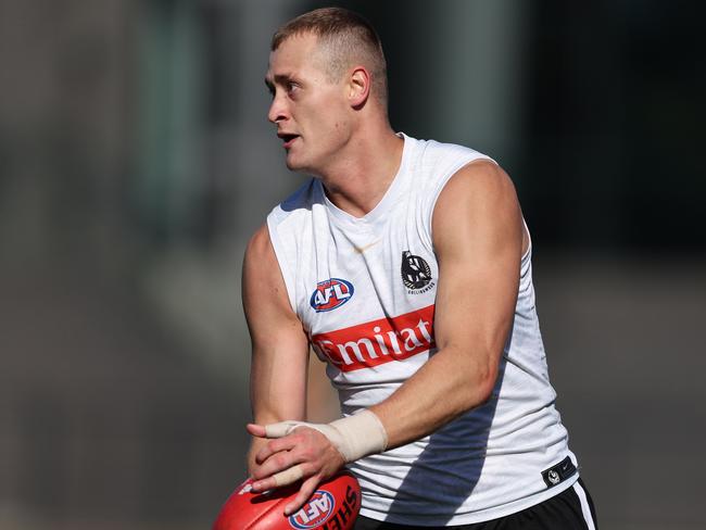 MELBOURNE, AUSTRALIA - MAY 01: Nathan Kreuger of the Magpies controls the ball during a Collingwood Magpies AFL training session at Olympic Park Oval on May 01, 2024 in Melbourne, Australia. (Photo by Robert Cianflone/Getty Images)