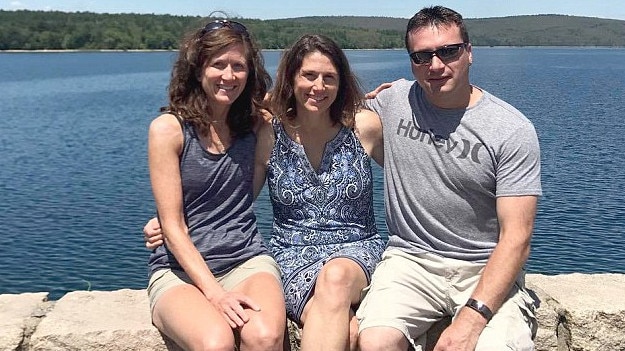 Deborah Ramirez, centre, with sister Denise and brother Mark. Picture: Facebook