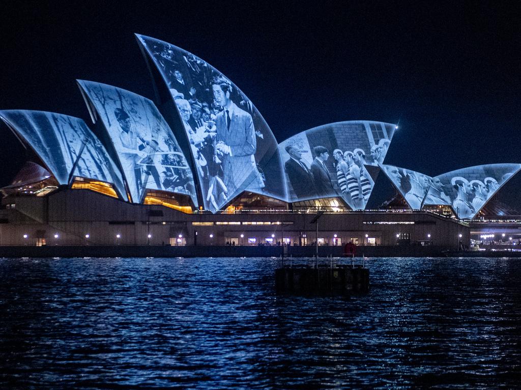 The Sydney Opera House sails display images of His Majesty King Charles III and Her Majesty Queen Camilla as they arrive in Sydney. Picture: NewsWire / Jeremy Piper