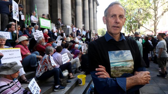 Bob Brown with protesters on the steps of Parliament House. Picture: Kelly Barnes/AAP