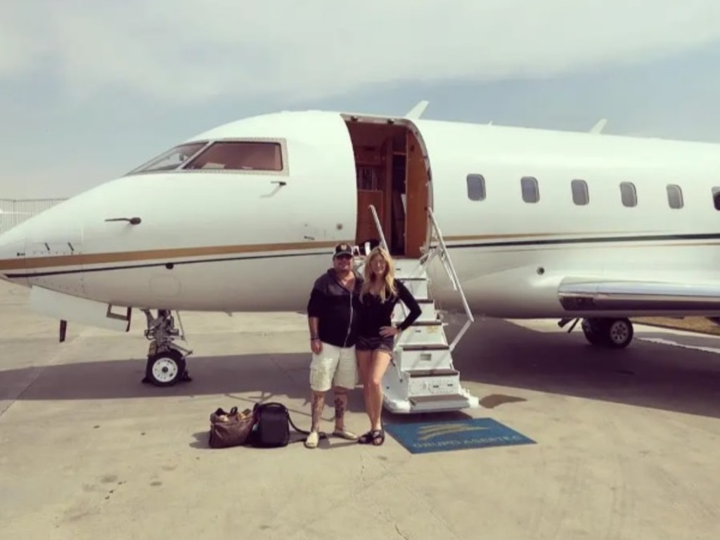 Vince Neil and Rain Hannah in front of his private jet in 2019. Picture: Instagram/TheSun