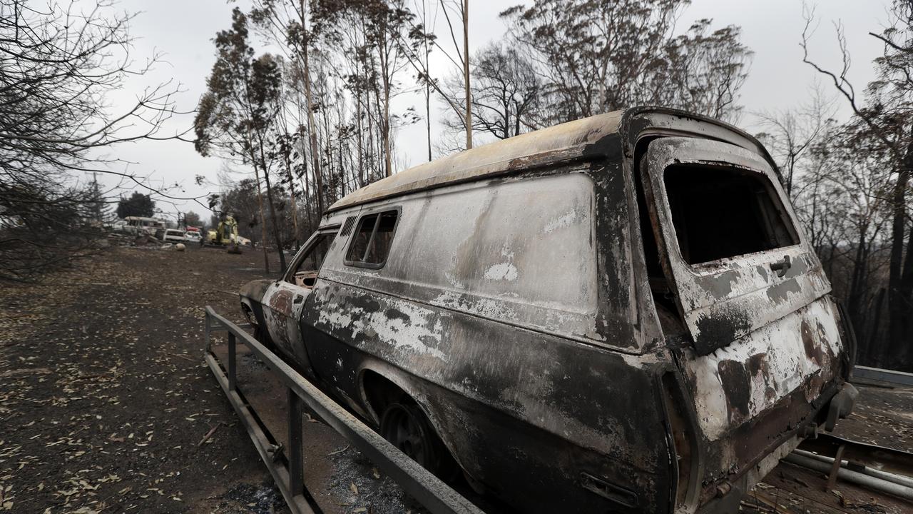 A car burnt out at Conjola Park, NSW. Photo: Rick Rycroft/AAP