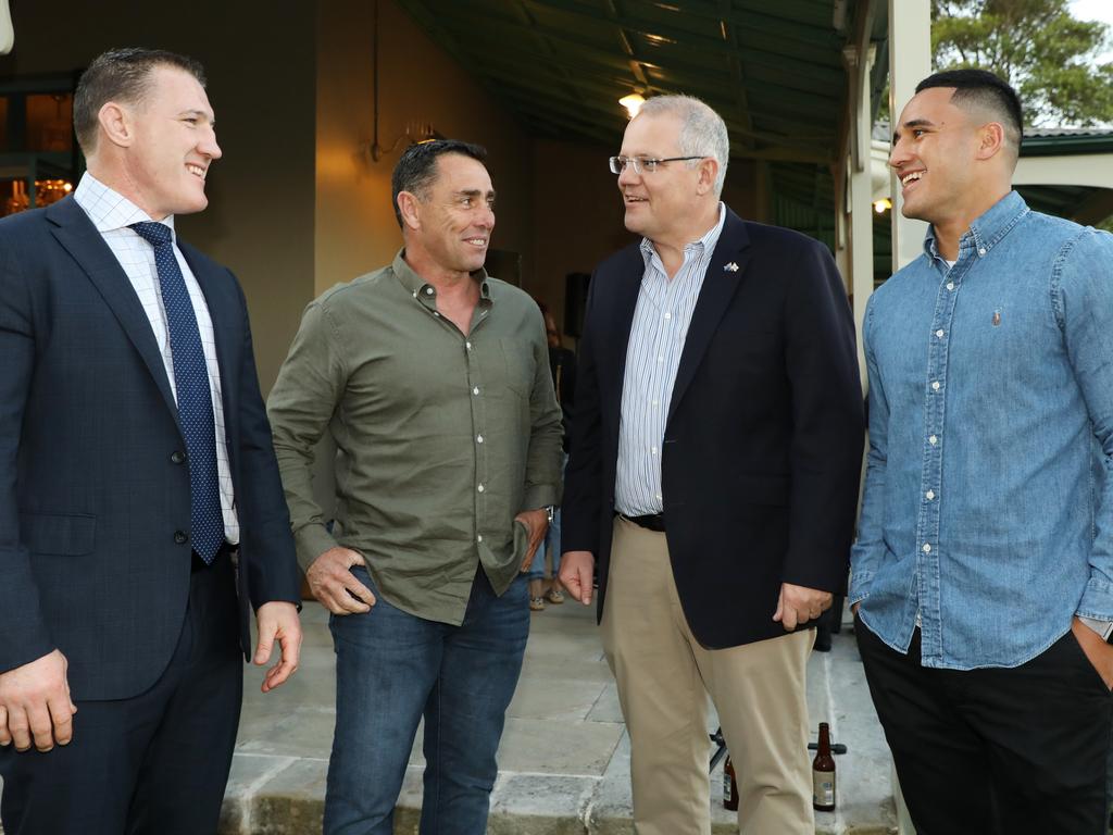 Valentine Holmes (right) played under Shane Flanagan (second from left) at the Sharks, where former Prime Minister Scott Morrison was a fan.