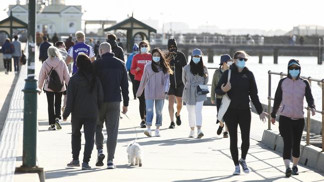 Walkers exercising at St Kilda Pier on the weekend. Picture: NCA NewsWire/Daniel Pockett