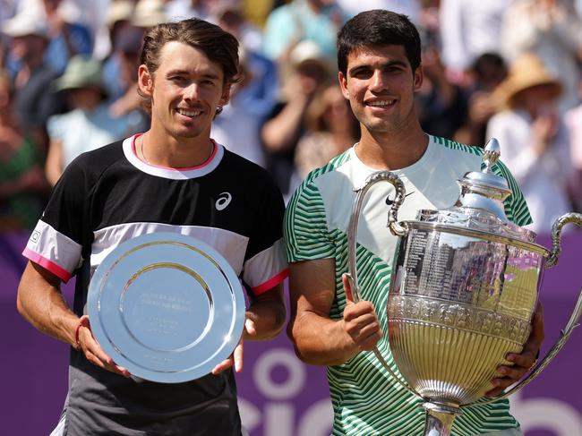 LONDON, ENGLAND - JUNE 25: Runner-up, Alex De Minaur of Australia and Winner, Carlos Alcaraz of Spain, pose with their trophies after the Men's Singles Final match on Day Seven of the cinch Championships at The Queen's Club on June 25, 2023 in London, England. (Photo by Julian Finney/Getty Images)