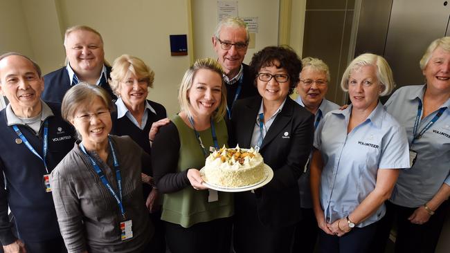 Epworth Eastern's group manager volunteer program Tara Cantwell and Nurse Unit manager Millie Flowers celebrate with a team of hospital volunteers.