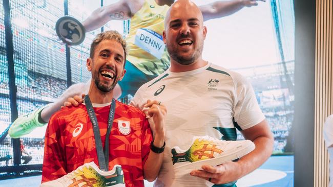 Australian discus thrower Matthew Denny with artist Anarchimyst who painted custum Asics shoes to celebrate Matt's Bronze medal at the paris 2024 Olympic games.