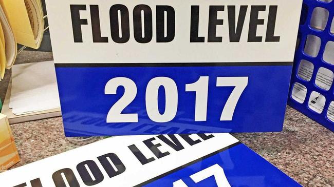 FLOOD SIGNS: Lismore City Council has free signs available for business owners to use to indicate the 2017 flood level in their premises. Picture: Supplied