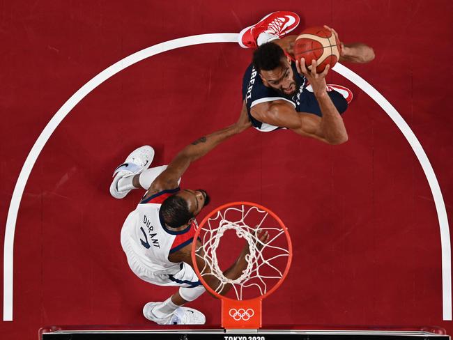 France's Rudy Gobert, right, looks to score against Kevin Durant. Picture: AFP