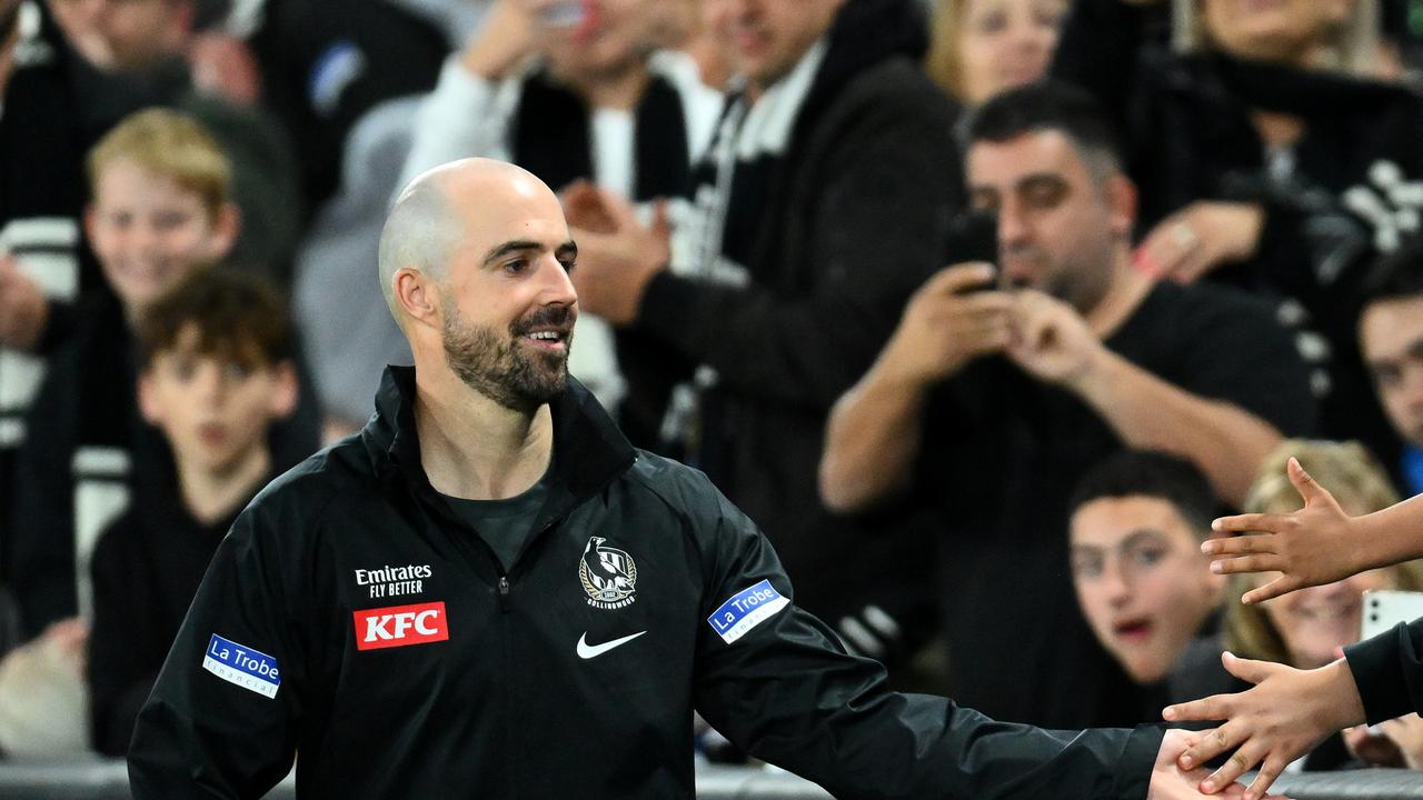 A knee injury in his milestone game didn’t stop Sidebottom celebrating with fans and teammates alike. (Photo by Quinn Rooney/Getty Images)