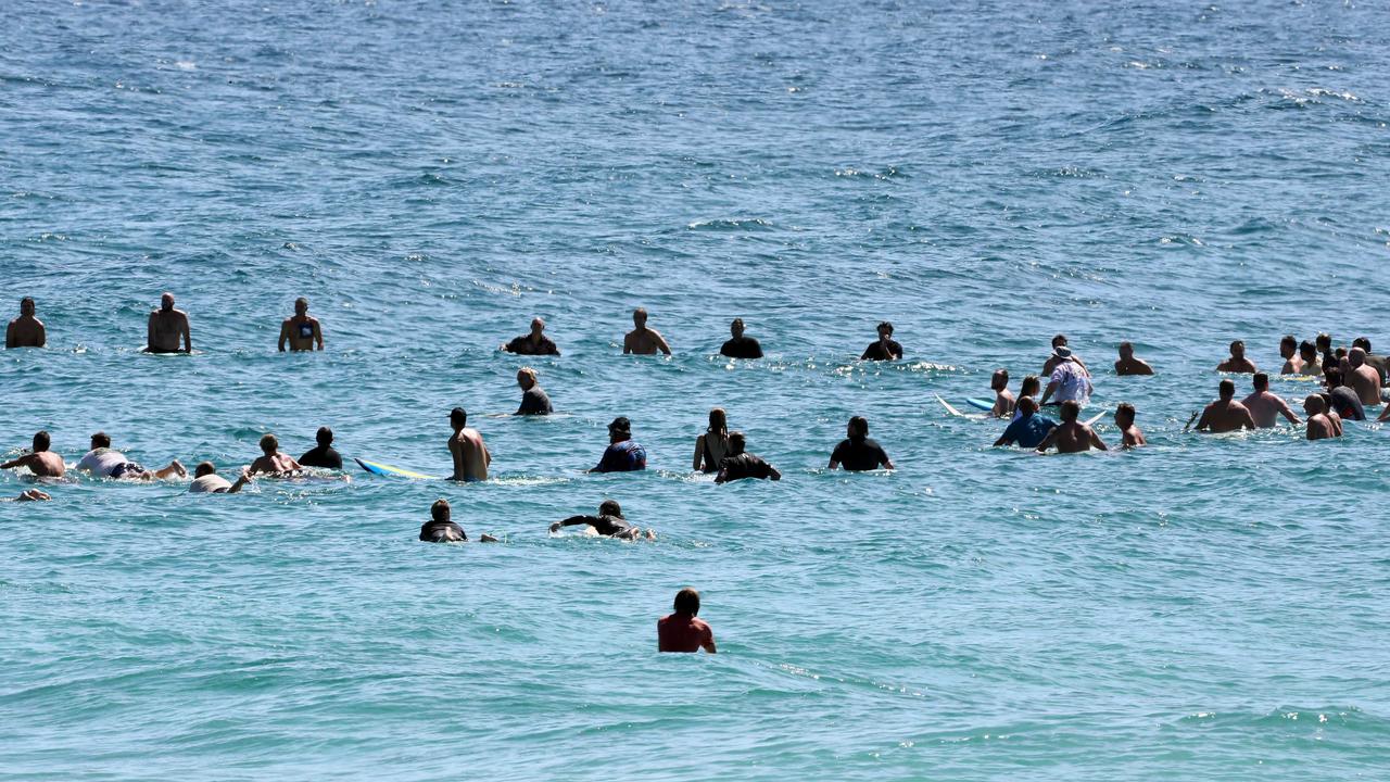 Mourners formed a paddle out, in honour of Ed Fanning. Picture: NCA NewsWire/Tertius Pickard