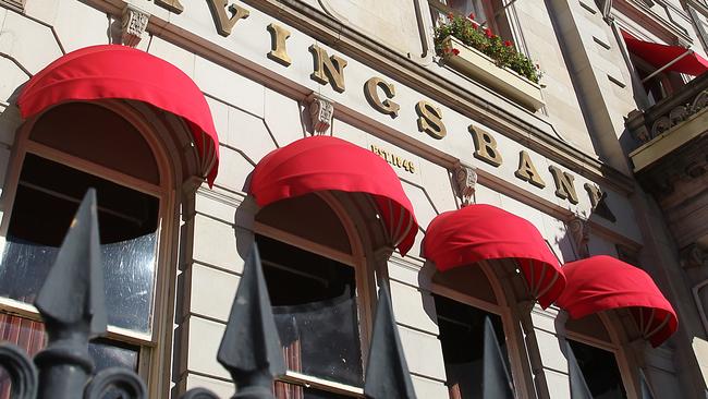 The semi-circular red awnings in place before the building owners were forced to remove them.