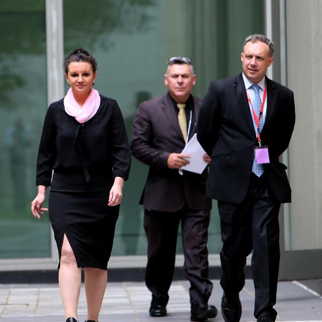 Senator Jacqui Lambie, her Chief of Staff Rob Messenger and her lawyer Glynn Williams before speaking at a press conference after she announced she has resigned from the Palmer United Party at Parliament House in Canberra in 2014.