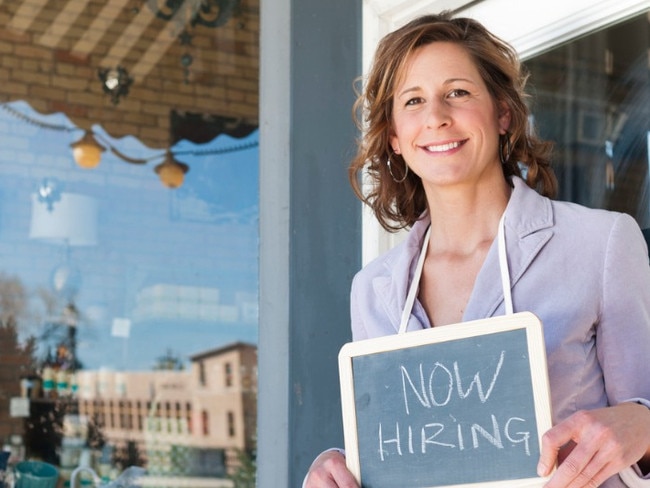 istock small business hiring sign woman