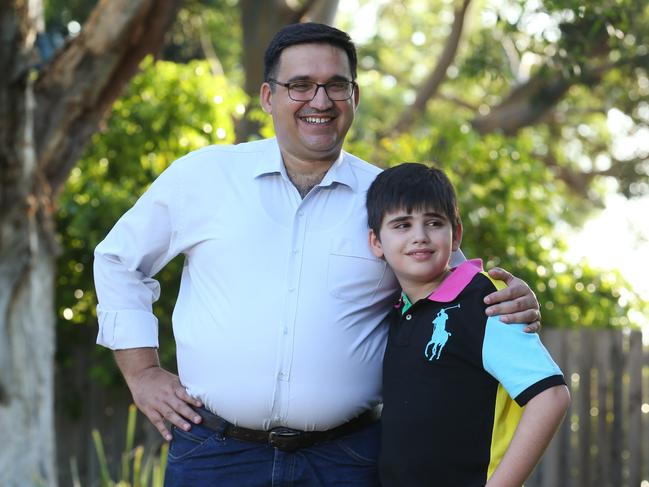 25/01/2019. Luay Al- Loo with his youngest son Fadi, 13, pictured near their home in Northmead in Sydney's West. Luay and his wife Rana and other son Zain moved to Australia  six years ago and will tomorrow become Australian citizens. They fled Iraq to Jordan as two engineers, and sought refuge in Australia through the UN. Britta Campion / The Australian