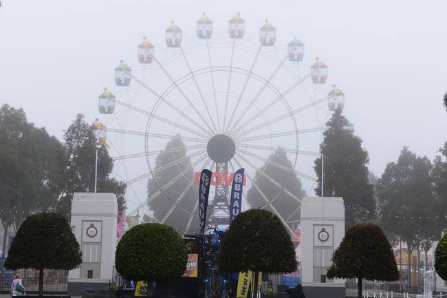 The ferris wheel is shrouded in fog. (Picture: AAP / Brenton Edwards