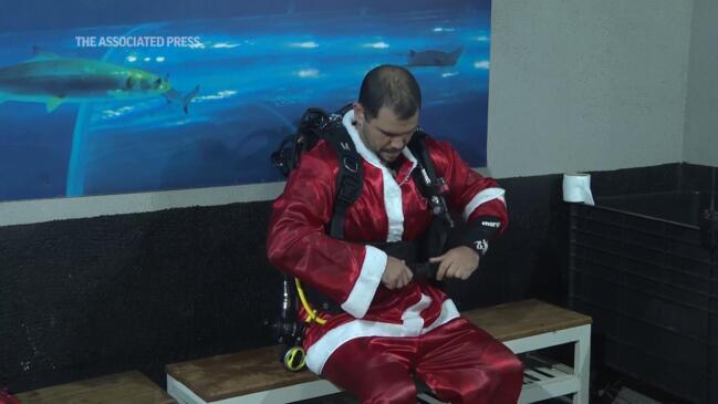 Diving Santa delivers festive cheers in Rio