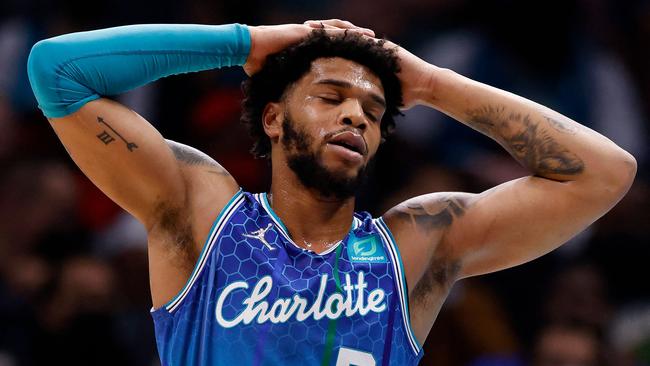 (FILES) In this file photo taken on February 09, 2022 Miles Bridges #0 of the Charlotte Hornets reacts during their loss to the Chicago Bulls at Spectrum Center in Charlotte, North Carolina. - Charlotte Hornets forward Miles Bridges was arrested on felony charges and released on bail while his wife posted social media photographs with face and body injuries. (Photo by GRANT HALVERSON / GETTY IMAGES NORTH AMERICA / AFP)