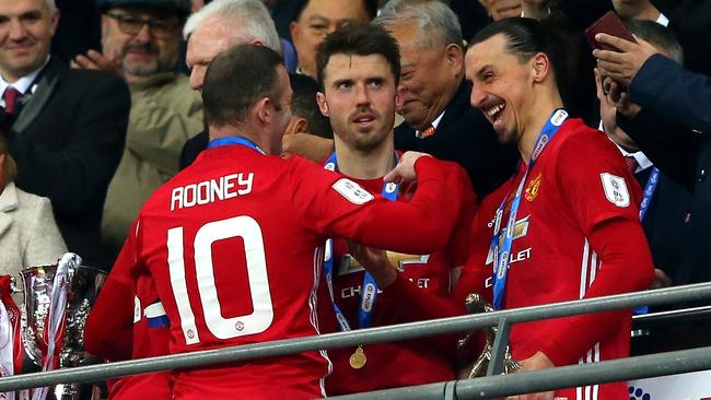 Wayne Rooney Michael Carrick and Zlatan Ibrahimovic of Manchester United.