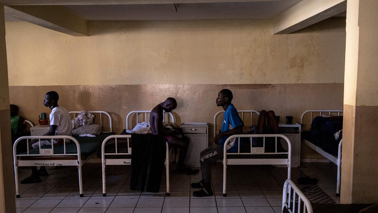 Recovering Kush addicts sit on their beds at the Kissy Mental Hospital in Freetown on June 22, 2023. Picture: John Wessels / AFP