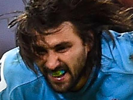 BRISBANE, AUSTRALIA - JULY 12: Jacques Potgieter of the Waratahs is tackled during the round 19 Super Rugby match between the Reds and the Waratahs at Suncorp Stadium on July 12, 2014 in Brisbane, Australia. (Photo by Ian Hitchcock/Getty Images)