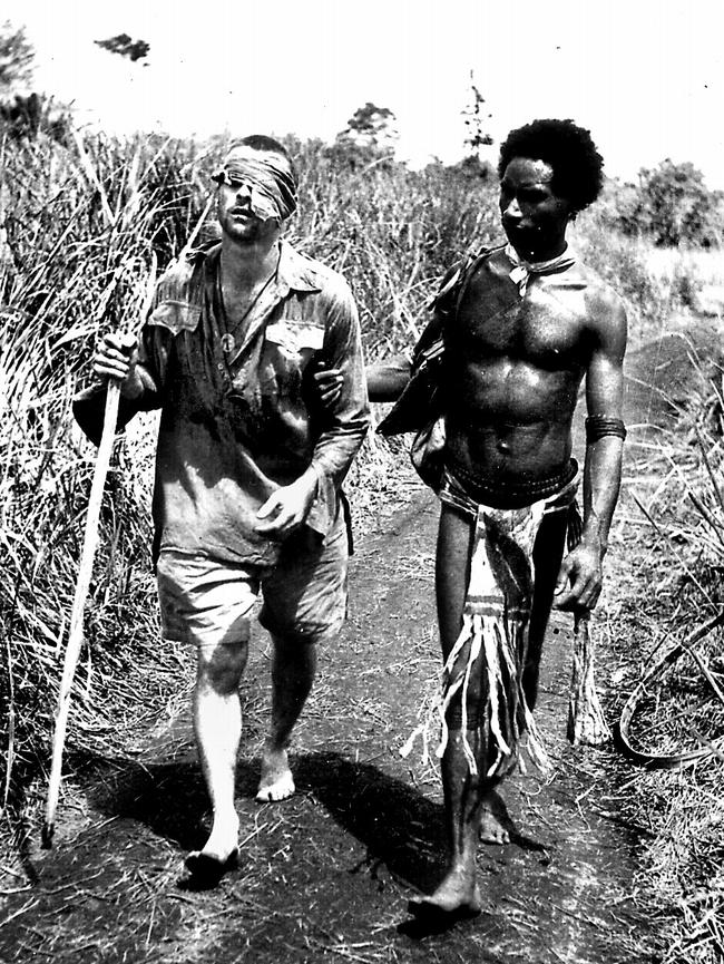 Raphael Oembari leads a wounded Australian soldier to safety in PNG during World War II.