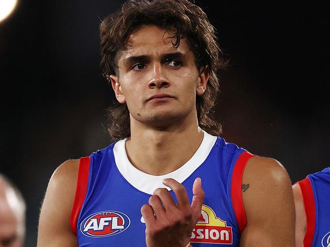 MELBOURNE . 25/03/2023.  AFL Round 2.  Western Bulldogs vs St Kilda at Marvel Stadium.  Bulldogs Jamarra Ugle-Hagan, Liam Jones and Oskar Baker walk off Marvel Stadium after tonights loss to St Kilda    . Pic: Michael Klein