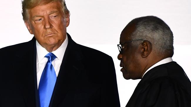 Justice Thomas and then-president Donald Trump at the swearing in ceremony for the most recently appointed justice, Amy Coney Barrett. Picture: Brendan Smialowski/AFP