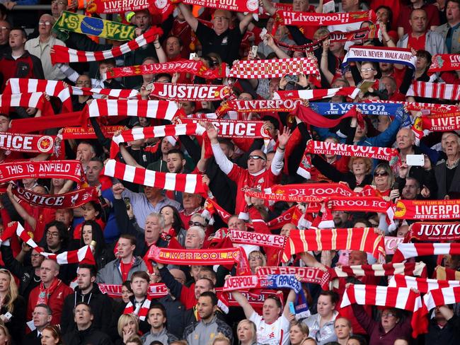 LIVERPOOL, ENGLAND - APRIL 15: Liverpool fans sing 'You'll Never Walk Alone' during the Hillsborough memorial service marking the 25th anniversary of the Hillsborough Disaster at Anfield stadium on April 15, 2014 in Liverpool, England. Thousands of fans, friends and relatives took part in the service at Liverpool's Anfield stadium to mark the 25th anniversary of the Hillsborough disaster. Bells across the City of Liverpool rung during a one minute silence. A total of 96 Liverpool supporters lost their lives during a crush at an FA Cup semi final against Nottingham Forest at the Hillsborough football ground in Sheffield, South Yorkshire in 1989. (Photo by Christopher Furlong/Getty Images) *** BESTPIX ***